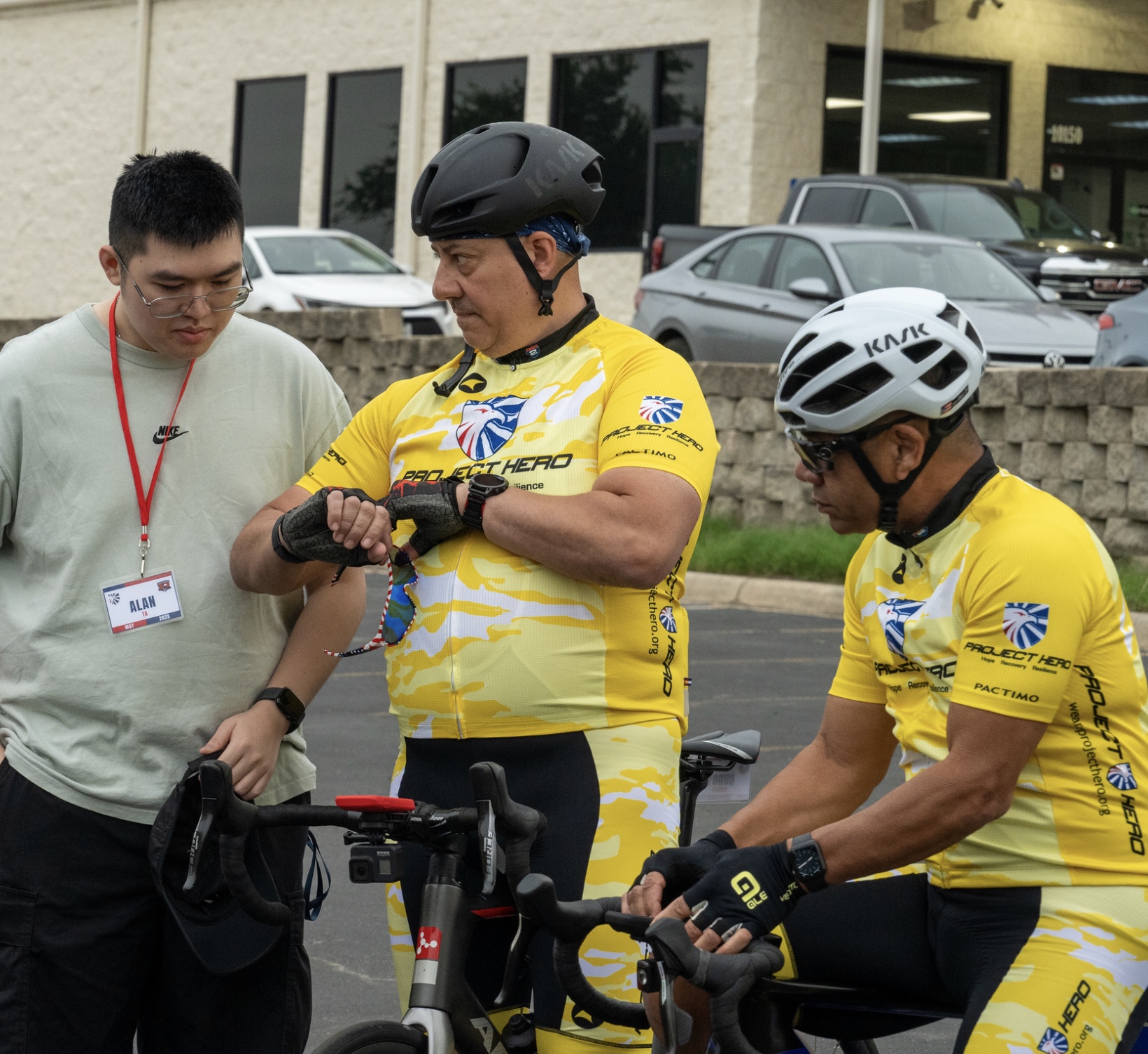 A group of cyclists preparing.